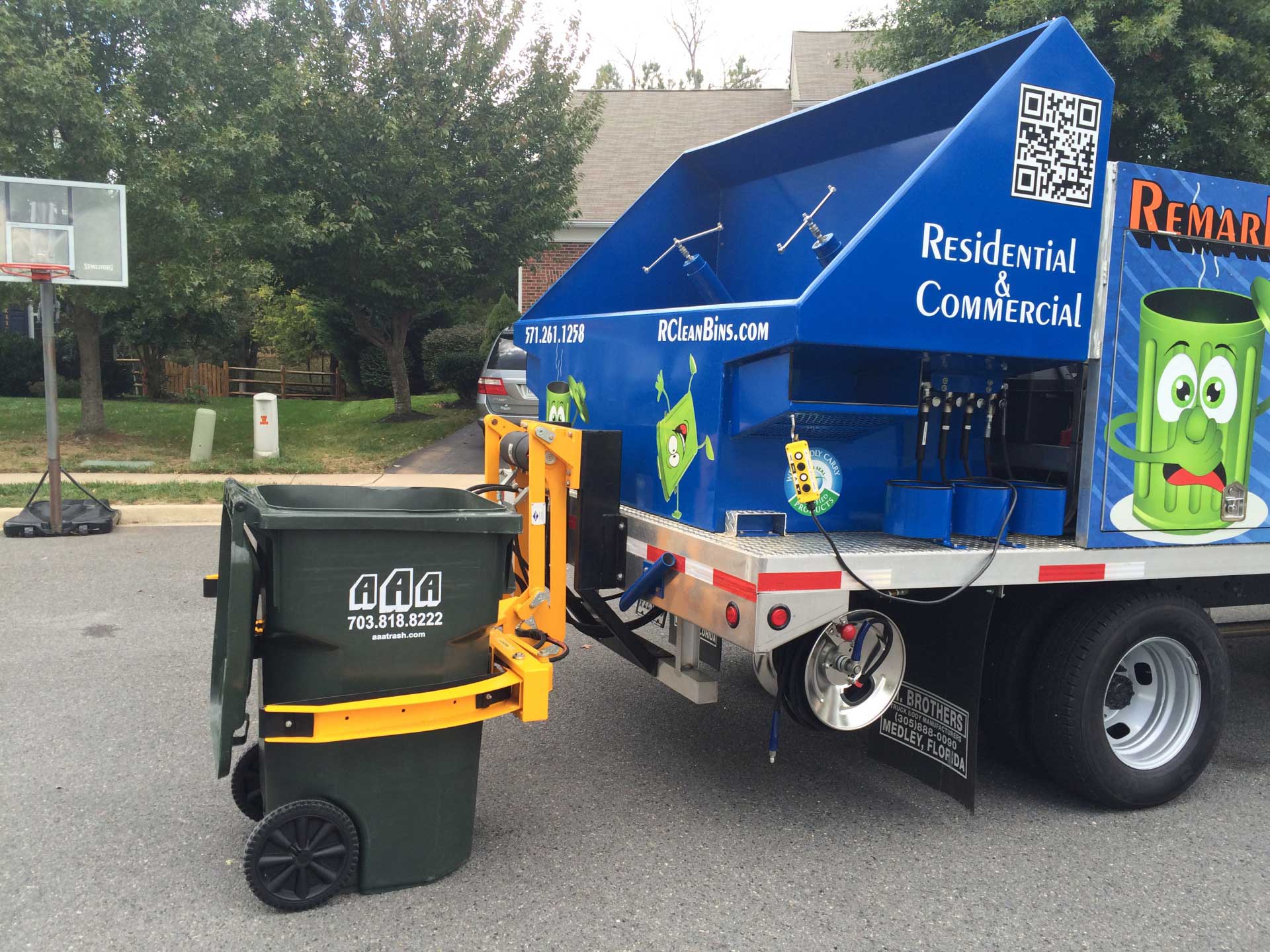this is a photo of a garbage truck that was used to clean up the sidewalk